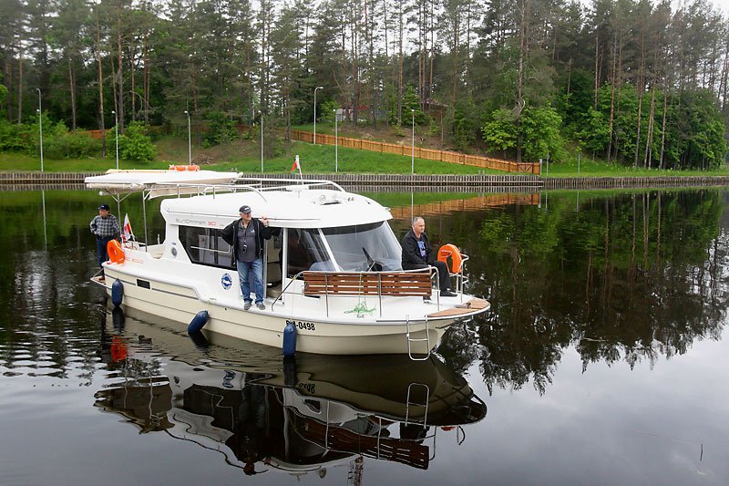 Tourists from Poland travel along Augustow Canal by yacht